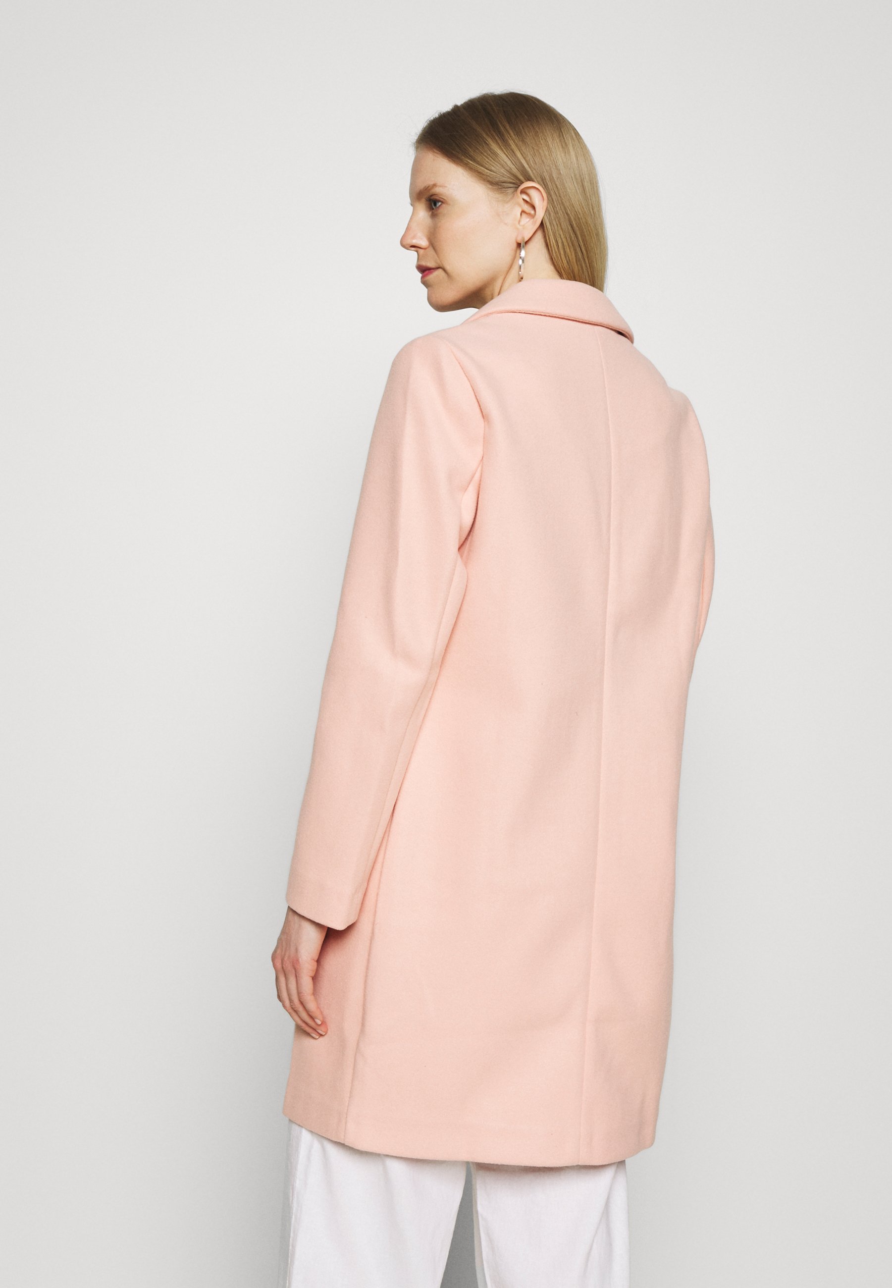 pink collarless coat