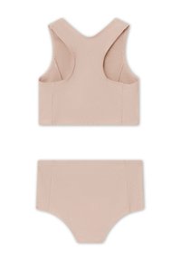 To-delt sett bestående av en ermeløs topp og høyt liv bunn. Laget av glatt, elastisk stoff i en lys beige farge.