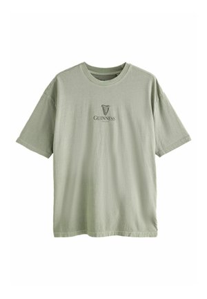 Light green cotton t-shirt featuring a round neckline and short sleeves, with a printed Guinness logo on the chest.