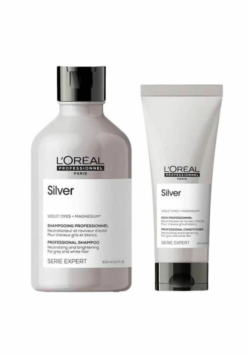Shampoo- und Conditionerflaschen von L’Oréal Professionnel in Silber mit schwarzen Kappen, gekennzeichnet zur Neutralisierung und Auffrischung von grauem und weißem Haar.