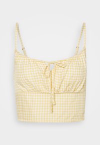 Yellow gingham crop top featuring thin adjustable straps and a front tie detail. The fabric is lightweight with a gathered texture.