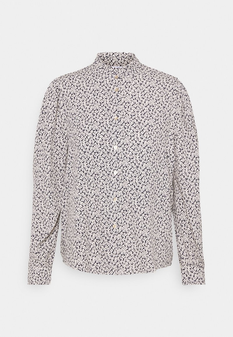 Chemise à manches longues en tissu bleu marine avec un petit motif floral blanc, dotée d'un col montant et de boutons dorés sur le devant.
