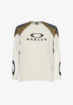 Beige Oakley shirt met lange mouwen, bruine en donkergrijze schouderpanelen, logo op de borst en ronde logo's op de mouwen.