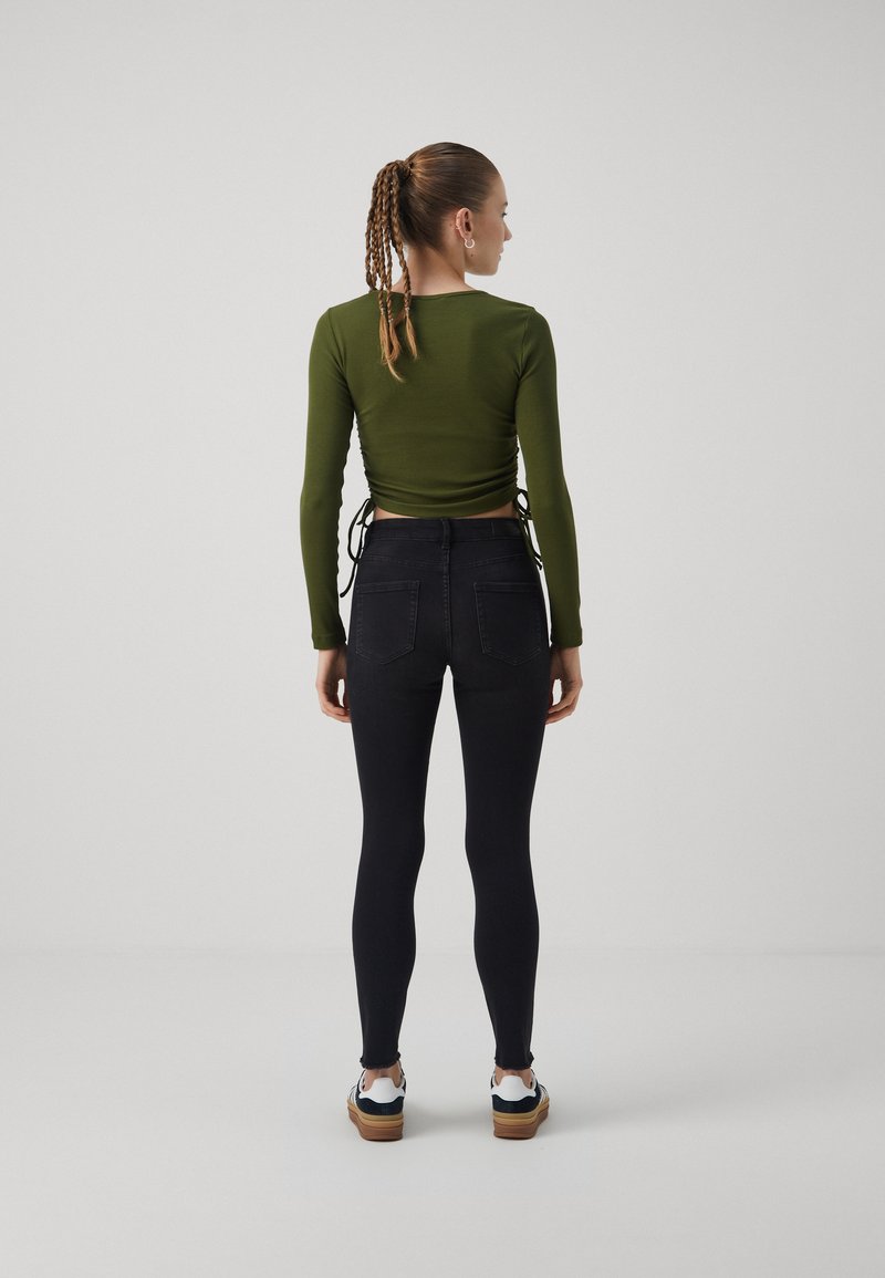 ONLY ONLBLUSH MID WAIST COATED - Flared Jeans - black/zwart