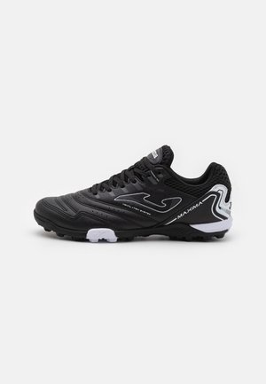 Black soccer shoes with a textured synthetic upper, mesh accents for ventilation, and white detailing on the side and sole.