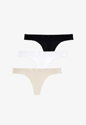 Culotte en tanga beige avec une texture lisse, offre une couverture minimale et une taille basse, conçue pour un ajustement sans couture.