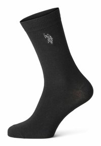 Schwarze Baumwollsocke mit geripptem Bündchen, das ein kleines gesticktes Design einer Figur zeigt, die eine Fackel seitlich hält.