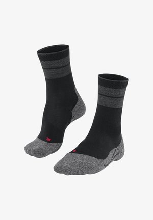 Schwarze Knöchel-Socken mit grauen Streifen, gepolstertem grauen Zeh und Ferse, mit einem kleinen roten Logo. Hergestellt aus einem strukturierten Stoff für Komfort.