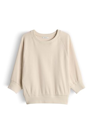 Felpa beige girocollo con maniche a tre quarti, polsini e bordo a coste, e cuciture raglan sulle spalle.