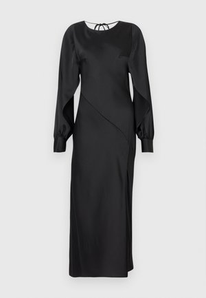 Rochie din satin negru cu decolteu rotund, mâneci lungi tip balon și un design asimetric. Prezintă un fundiță la spate.