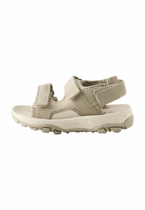 Smėlio spalvos basutės atviru priekiu su reguliuojamais lipdukais ant dirželių, paminkštintu padu ir tvirtu pado profiliu lauko vaikščiojimui.