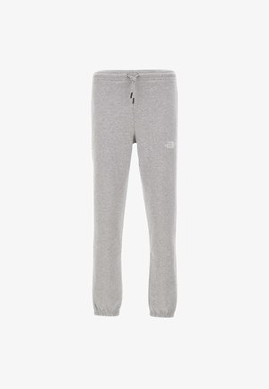 Pantalons de survêtement gris en tissu doux, dotés d'une taille élastique avec cordon de serrage et de poignets élastiques. Le logo The North Face est affiché sur la cuisse gauche.