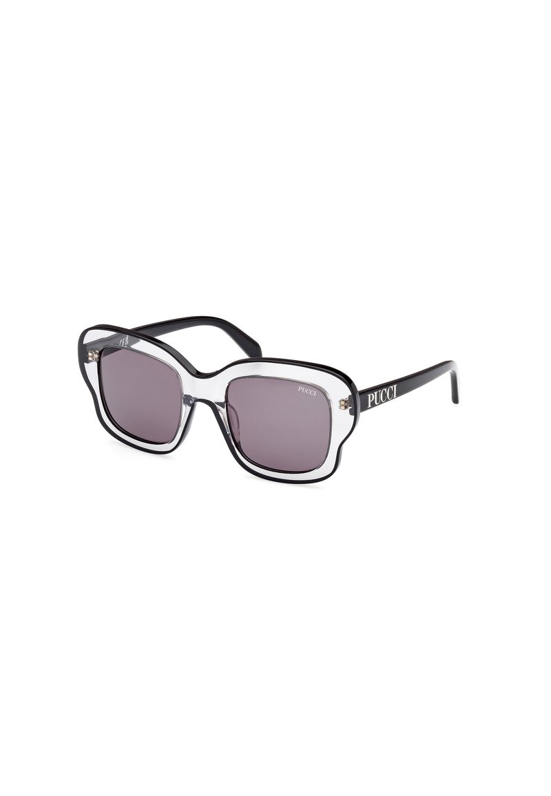 Gafas de sol sobredimensionadas en negro y transparente con lentes cuadrados y una forma audaz. Presentan un sutil logo de la marca en la patilla y un acabado suave.