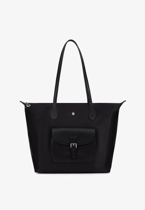 Black tote bag with long handles, front flap pocket with buckle, and zipper closure on top, set against a white background.