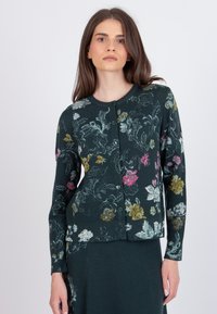 Dark green cardigan with floral patterns in pink, yellow, and white. Features a round neckline and button closure down the front.