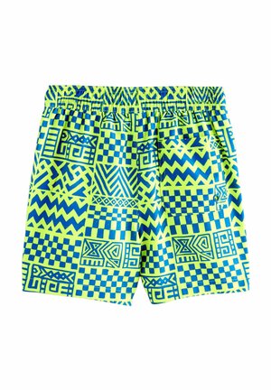 Žiarivozelené plavky s modrými geometrickými a cik-cak vzormi, elastickým pásom a zadnou kapsou so zapínaním na gombík.