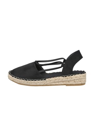 Sandalia espadrille negra de puntera cerrada con tiras cruzadas y suela de cuña envuelta en yute sobre fondo blanco.