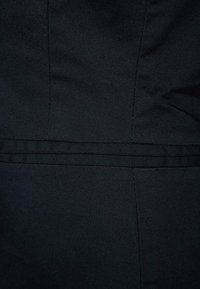 Black fabric textile featuring a smooth, even texture with subtle sheen. Styled with vertical seams and a horizontal accent band.