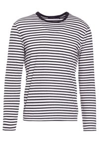 Långärmad randig skjorta med vita och mörkblå horisontella ränder, rund halsringning och en mjuk textur. Har en avslappnad passform.
