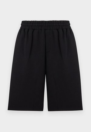 Svarte shorts med løs passform og elastisk rynket midje, laget av glatt stoff, vist flatt mot hvit bakgrunn.