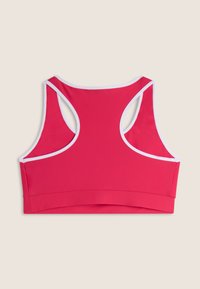 Reggiseno sportivo rosso realizzato in un tessuto liscio ed elastico. Presenta un design a schiena scoperta con bordi bianchi e una fascia larga in fondo.