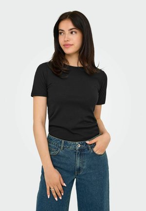 Zwart T-shirt met korte mouwen, gemaakt van zachte stof, met een aansluitend ontwerp en een ronde halslijn, gecombineerd met hoge blauwe jeans.