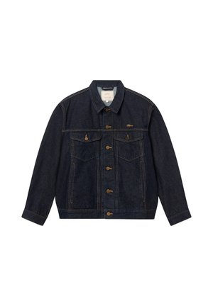 Tummansininen farkkutakki, jossa napillinen etuosa, kaksi napillista rintataskua, sivutaskut ja vasemmassa rinnassa kultainen "Oblique"-logo.