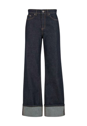 Tumedad sinised laiad teksad, millel on ümardatud ääred, ees nupuga ja tõmbluku sulgemine ning oranžid õmblused.