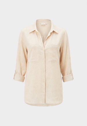 Béžová košeľa s dlhým rukávom, golierom, dvoma náprsnými vreckami a vyhrnutými rukávmi.