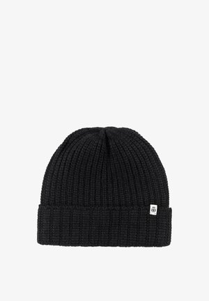 Black knitted beanie with folded cuff and small white rectangular logo tag on the edge.