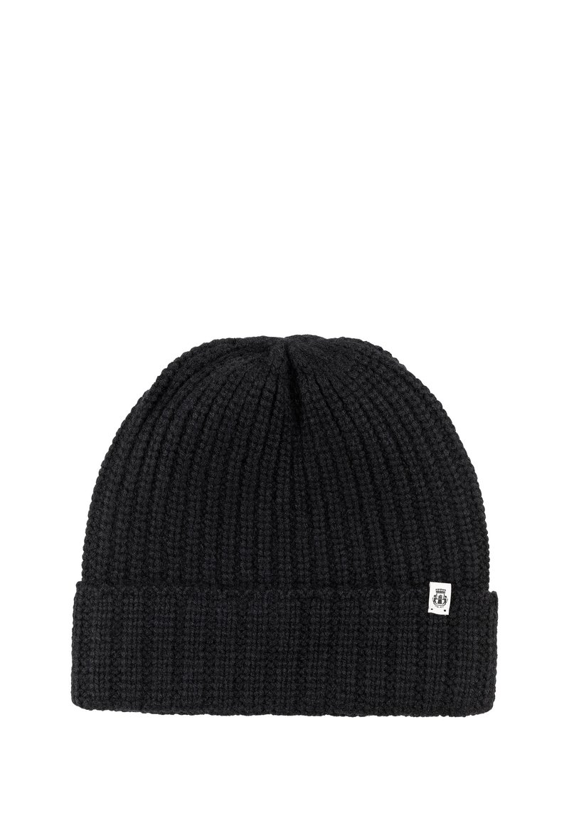 Black knitted beanie with folded cuff and small white rectangular logo tag on the edge.