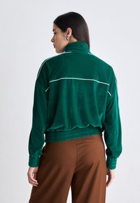 Lacoste Sweater met rits - fluorine foncé/white