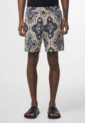 Beige Badehose mit Muster, ausgestattet mit einem geometrischen Design in Lila und Schwarz, einem Kordelzugbund und einem lockeren Schnitt.