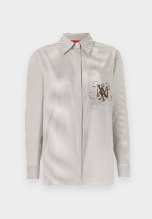 Camicia a righe con bottoni in beige chiaro e marrone. Presenta una tasca con un monogramma marrone decorativo. Maniche lunghe con polsini abbottonati.