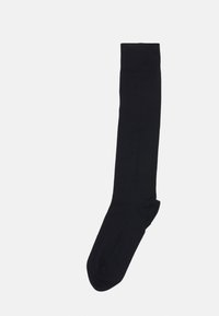 Calza nera al ginocchio realizzata in materiale morbido, con una texture liscia e un bordo a coste strutturato nella parte superiore per una vestibilità sicura.