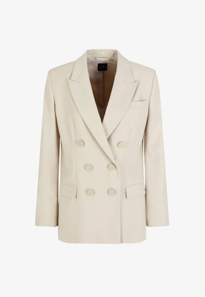 Blazer beige doppiopetto con grandi bottoni, revers a scollo a V, tasche laterali e vestibilità su misura. Tessuto liscio con minimal dettagli.