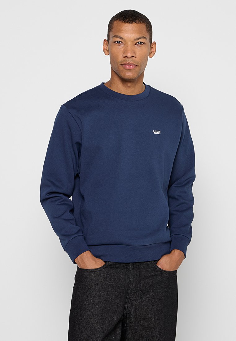 Marineblauwe sweatshirt van een katoenmix. Ronde hals, ribgebreide manchetten en zoom, met een klein wit logo op de borst.
