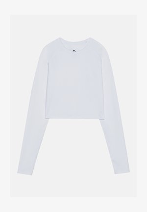 Cropped long-sleeve top in solid white, made of soft fabric, featuring a rounded neckline and raglan sleeve design with no visible hardware.