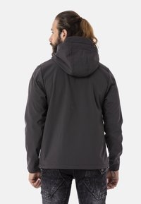Dunkelgraue wasserfeste Jacke mit Kapuze, glatter Oberfläche und verstellbarem Kordelzug am Saum. Verfügt über flache Nähte und ein minimalistisches Design.