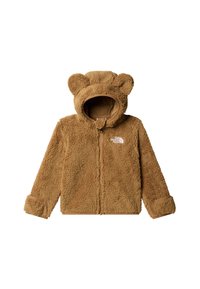Jachetă maro din fleece cu urechi de urs pe glugă. Are fermoar frontal, manșete elastice și logo-ul The North Face alb. Textură moale.