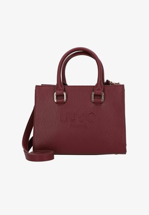 Borsa a mano in pelle color bordeaux con forma strutturata, doppio manico superiore, logo inciso e tracolla rimovibile. Dettagli in metallo color argento.