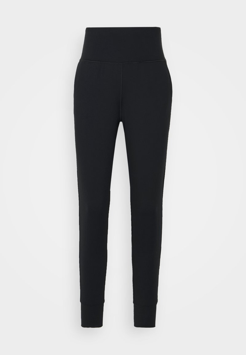 Svarta leggings i stretchigt material. Hög midja, smalnande ben och åtsittande muddar vid vristerna. Inga mönster eller detaljer.