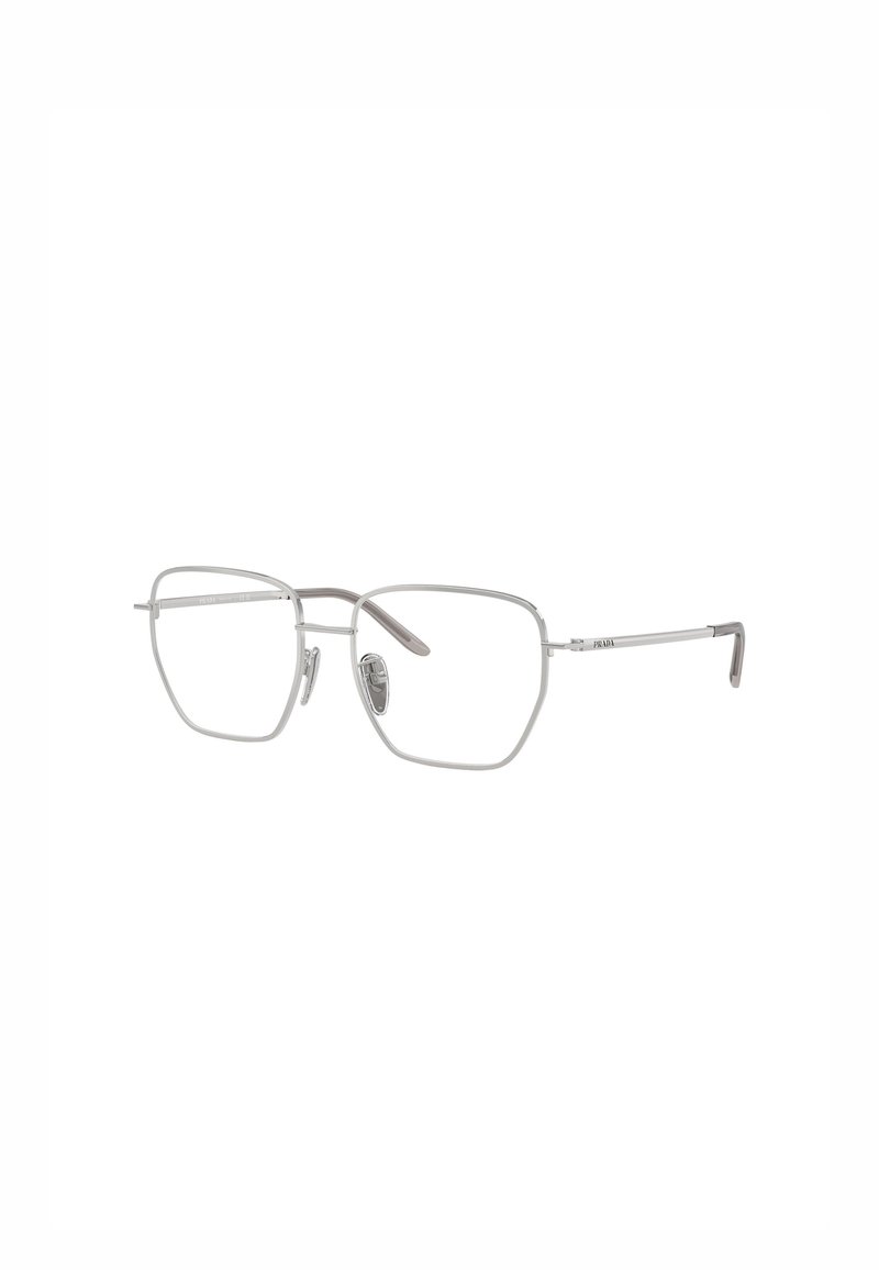 Occhiali in metallo argentato dalla forma rettangolare, con montatura sottile in filo e lenti trasparenti. Presentano naselli regolabili e aste sottili.