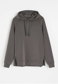Szara bluza z kapturem o luźnym kroju, z rękawami raglanowymi, bocznymi szwami i teksturowanym wykończeniem materiału. Sznurki przy kapturze.