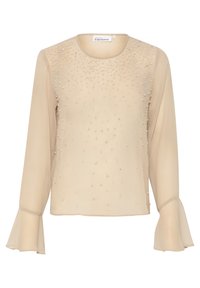 Beige pitkähihainen paita kevyessä kankaassa, jossa on pyöreä pääntie ja liehukkeet, koristeltuna pienillä, hajallaan olevilla helmimäisillä koristeilla.