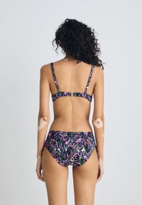 Black bikini with a colorful floral pattern in purple and green; includes adjustable straps and a clasp back detail.