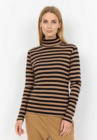 Långärmad polokrage topp med horisontella svart och beige ränder, tillverkad av ribbat tyg, med en åtsittande siluett och mjuk textur.