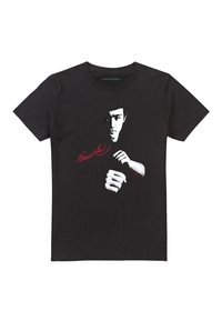 Black cotton t-shirt featuring a white graphic of a face and hands, with red text that reads "Bruce Lee" beneath the image.