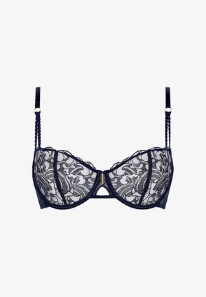 Soutien-gorge balconnet en dentelle bleu marine avec broderies florales, bonnets translucides, un fermoir doré à l'avant et des bretelles texturées décoratives.