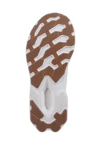 Suela blanca de un zapato que presenta un patrón de tracción de goma marrón texturizada con formas geométricas y acentos elevados para ofrecer agarre y tracción.